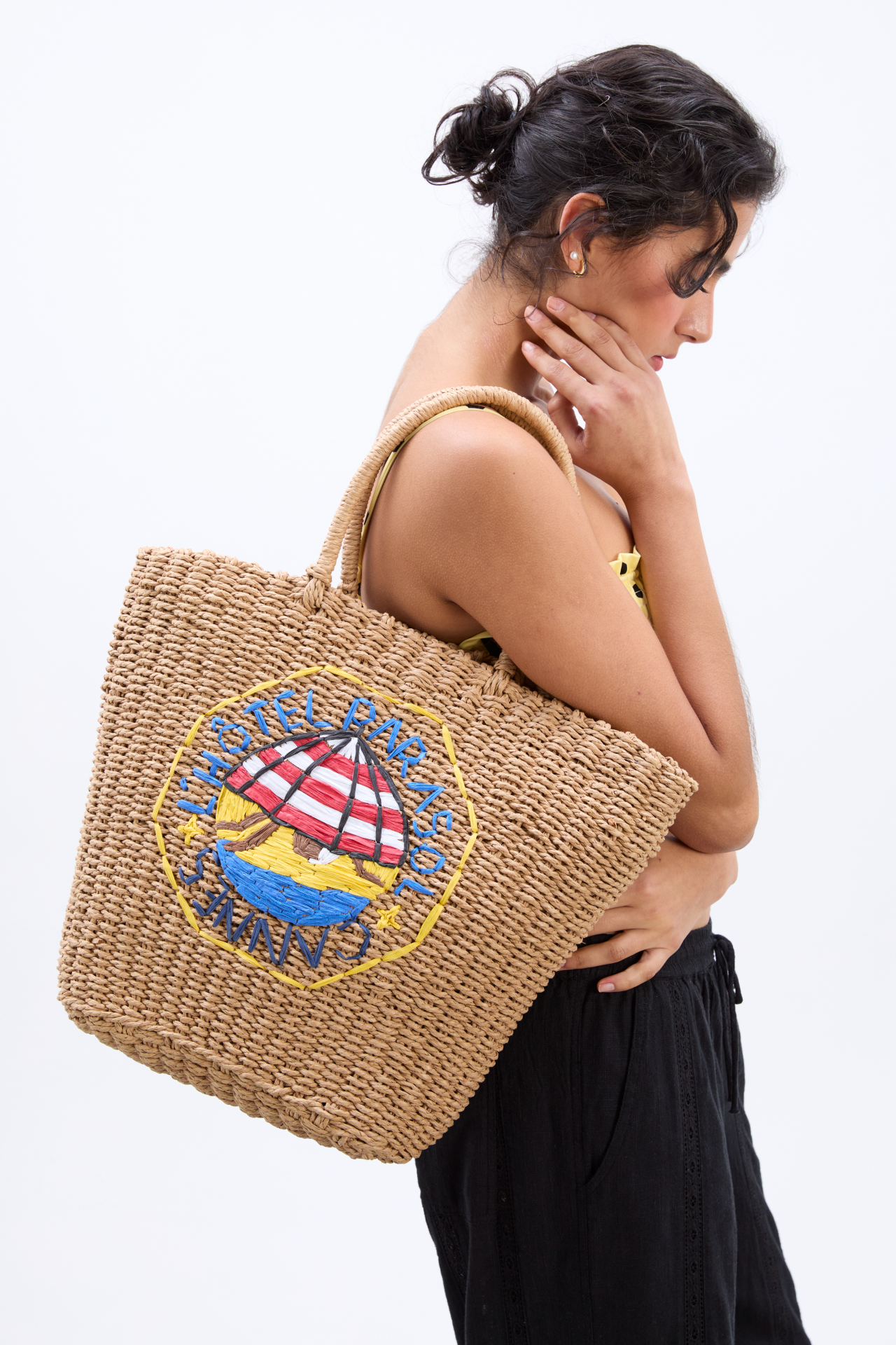 straw market bag with l'hotel embroidery